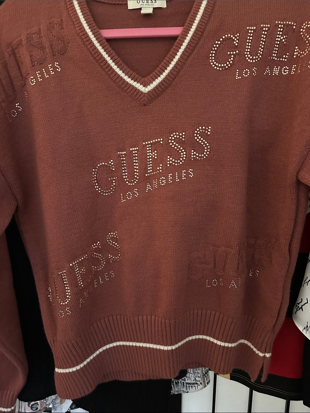 Here’s a stunner! GUESS V-Neck Sweater in Rust, Cream Trim, Crystal Logo Accents